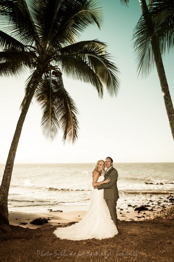 Couple between two palms